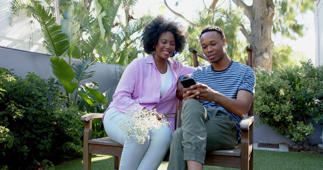 Smiling Couple Taking Selfie in Beautiful Garden