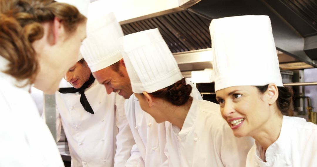 Team of Chefs Collaborating in Busy Restaurant Kitchen