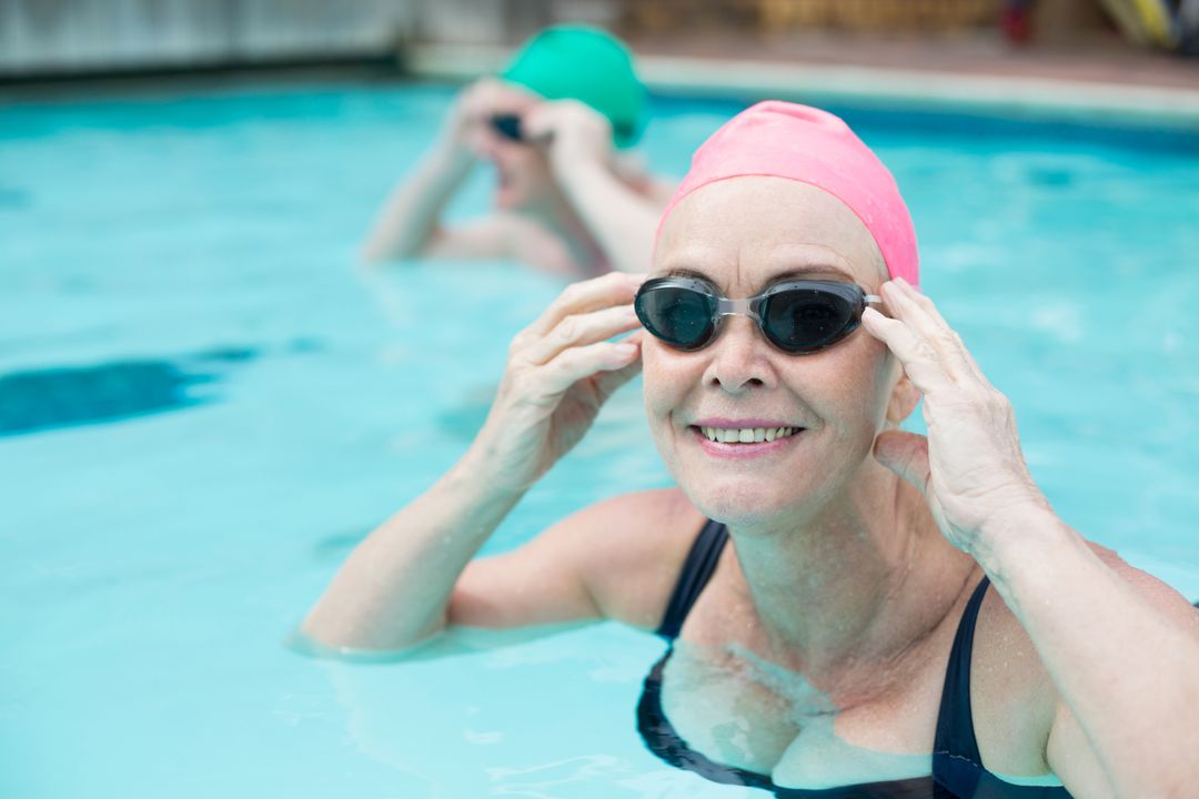 Portrait of mature woman swimming in pool - Free Images, Stock Photos and Pictures on Pikwizard.com