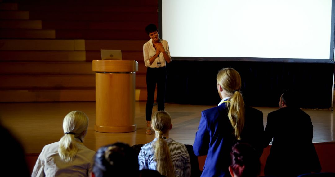 Businesswoman Engaging Audience During Presentation - Free Images, Stock Photos and Pictures on Pikwizard.com