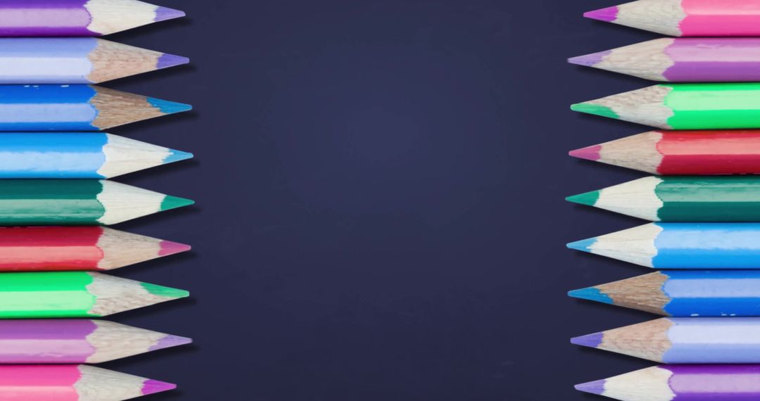 Colorful Pencils on Blue Background with Blank Space