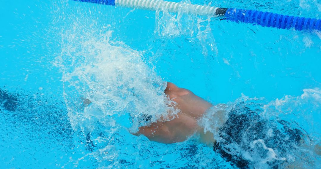 Swimmer Performing Backstroke in Pool Creates Splash - Free Images, Stock Photos and Pictures on Pikwizard.com