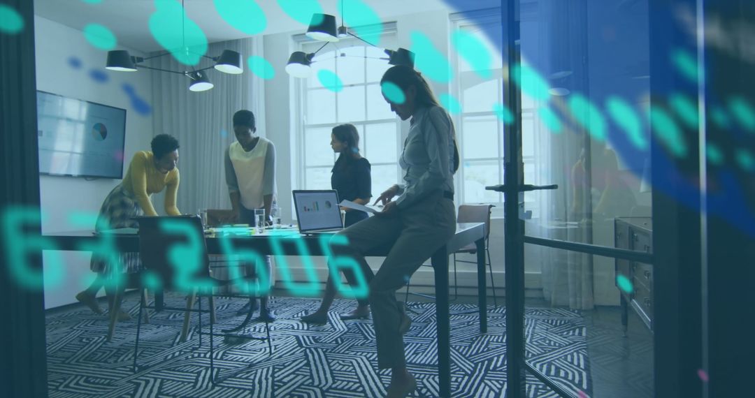 Diverse Team Collaborating Over Financial Data in Modern Office