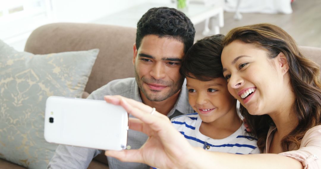 Happy Mixed-Race Family Taking Selfie on Couch at Home - Free Images, Stock Photos and Pictures on Pikwizard.com