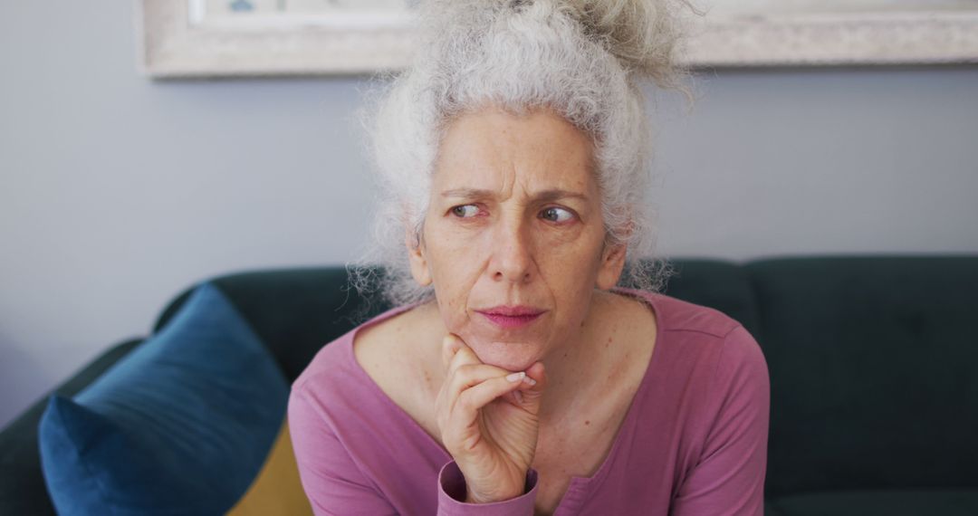 Pensive Senior Woman with Gray Hair Contemplating Indoors - Free Images, Stock Photos and Pictures on Pikwizard.com