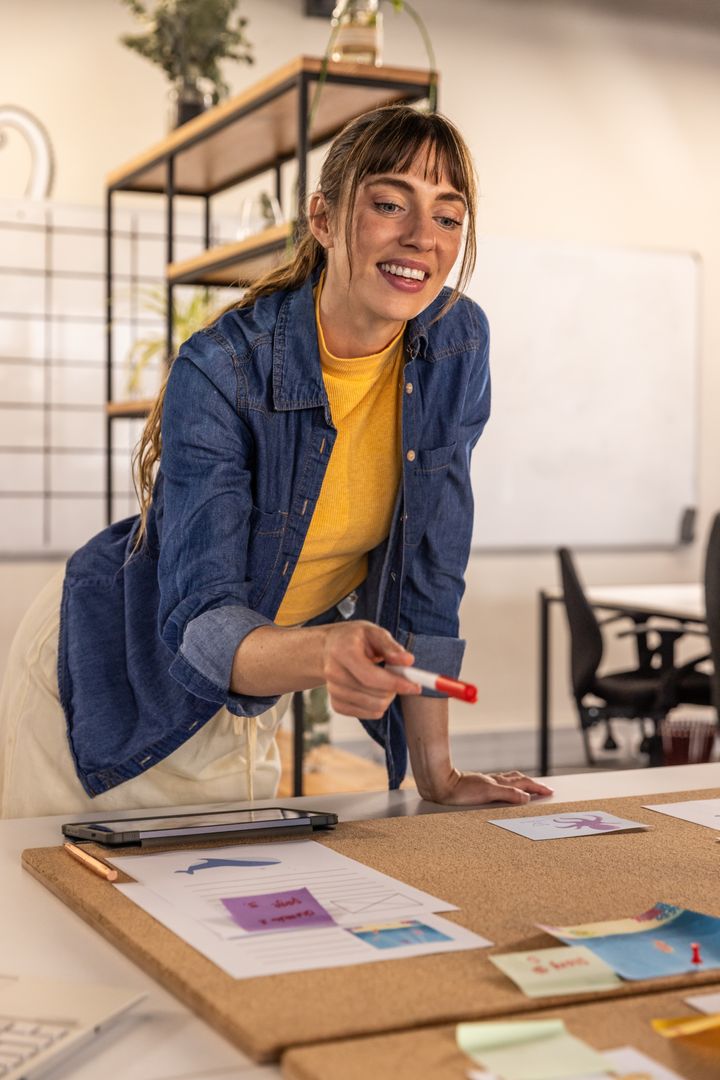 Female Designer Collaborating on Creative Project in Modern Office