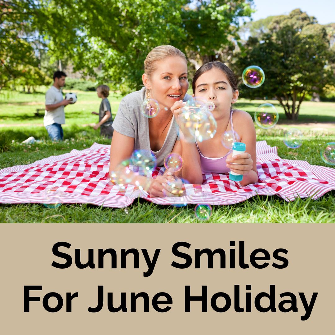 Mother and Daughter Blowing Bubbles on Picnic Blanket
