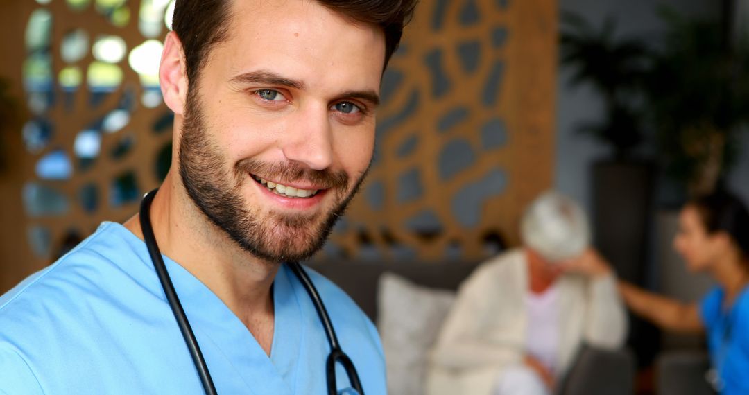 A young Caucasian male nurse smiles at the camera, with copy space - Free Images, Stock Photos and Pictures on Pikwizard.com