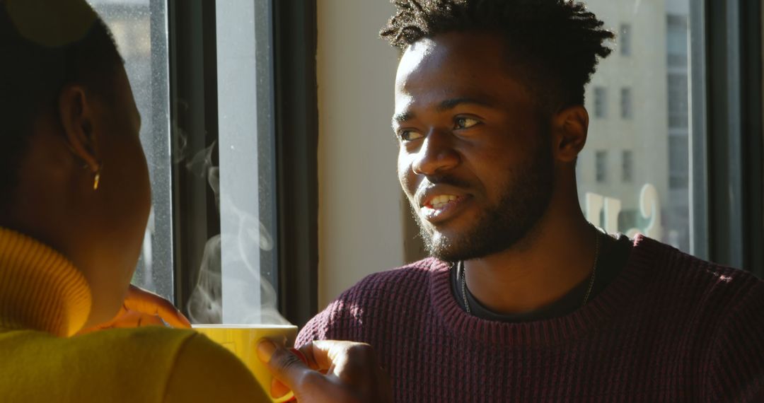 Engaging Conversation Amidst Warm Daylight Indoors