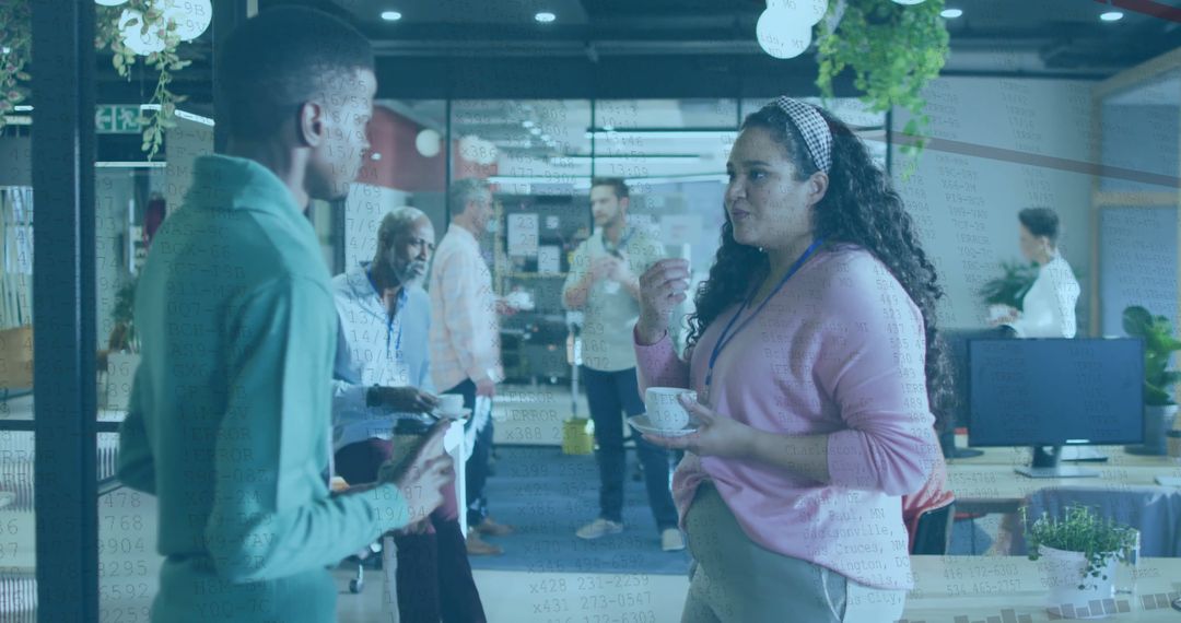 Professionals Conversing in Modern Collaborative Office Environment