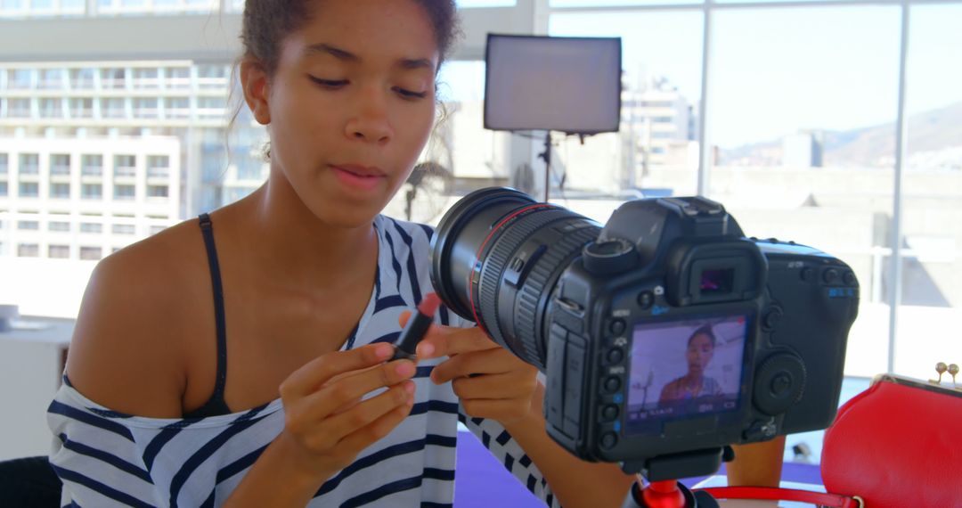 Woman Filming Makeup Tutorial with Professional Camera in Bright Room - Free Images, Stock Photos and Pictures on Pikwizard.com