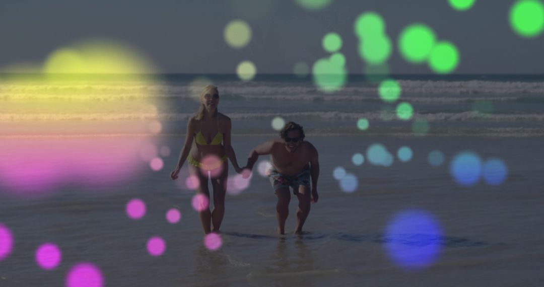 Couple Running on Beach with Colorful Bokeh Overlay