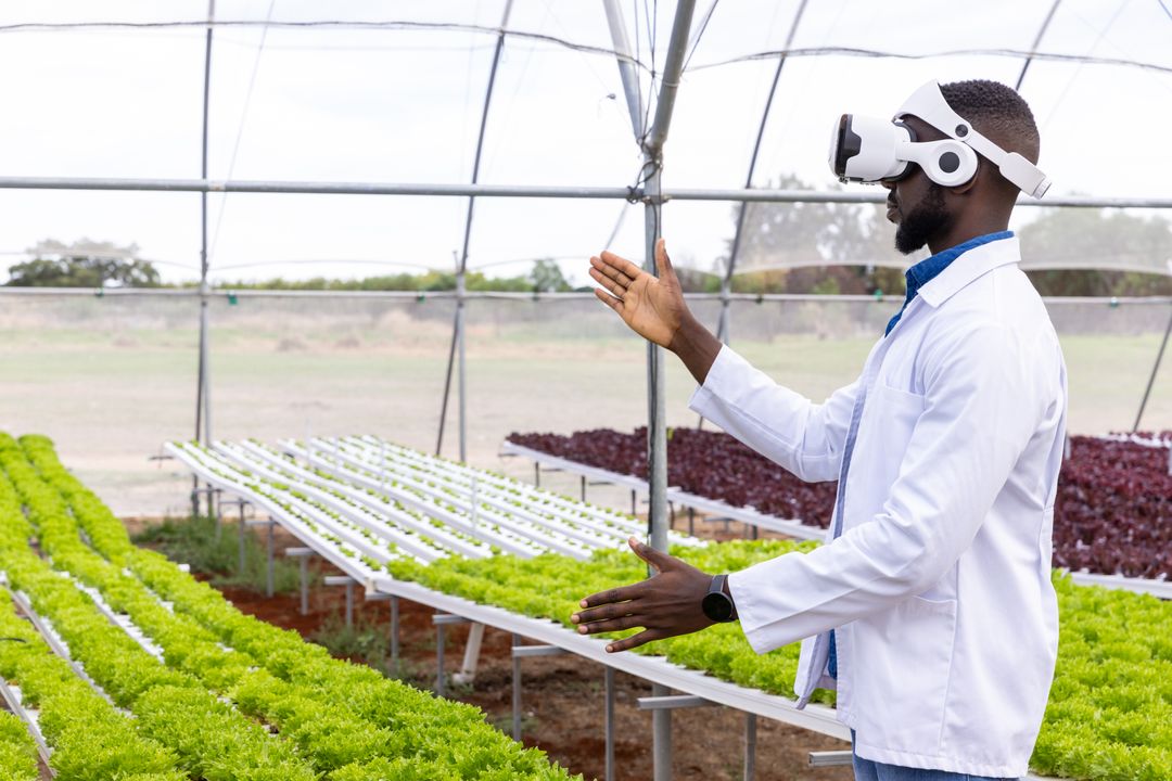 Scientist in Greenhouse Using Virtual Reality for Sustainable Agriculture
