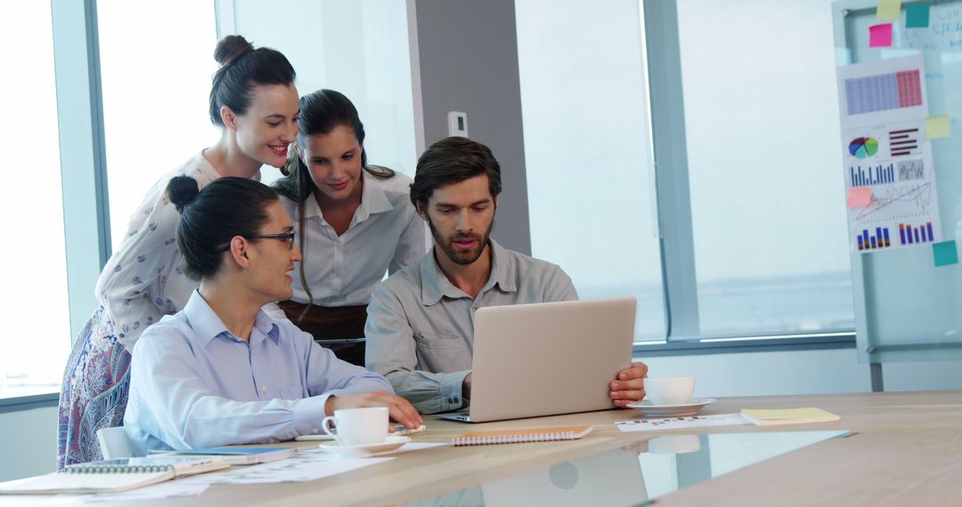 Collaborative Team Discussing Projects in Modern Office