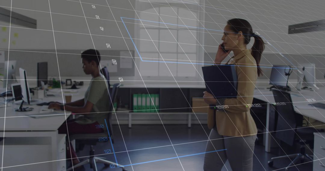 Businesswoman in Open Plan Office Using Communication Technology