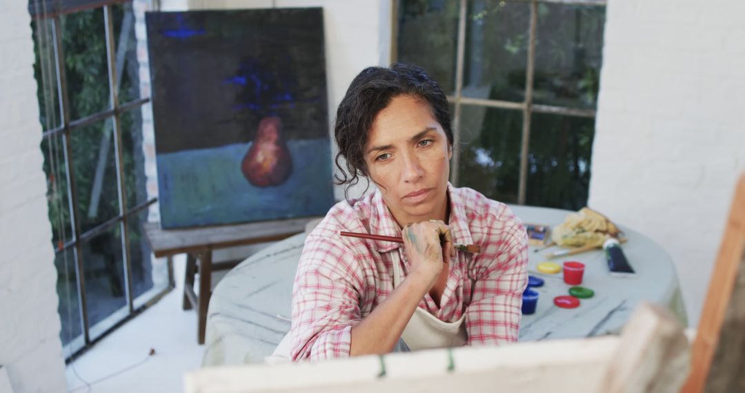 Pensive Artist in Studio Portrait - Free Images, Stock Photos and Pictures on Pikwizard.com