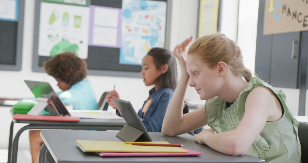 Students Engaged in Classroom Learning Using Tablets at Desks - Free Images, Stock Photos and Pictures on Pikwizard.com