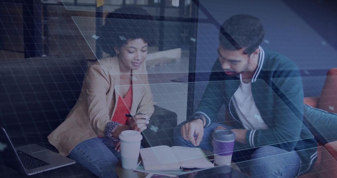 Diverse Colleagues Collaborating Over Coffee in Coworking Space