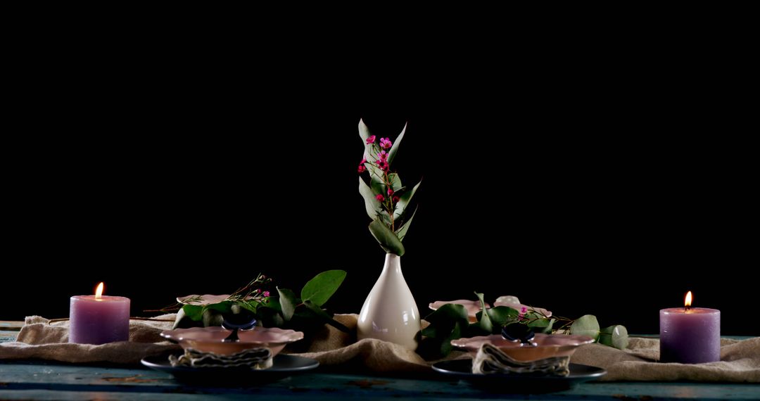 Elegant Table Setting with Candles, Leaves, and Flowers Against Black Background - Free Images, Stock Photos and Pictures on Pikwizard.com