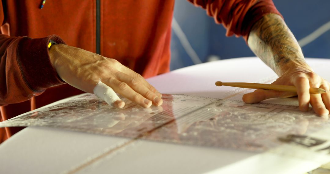 Person Shaping Surfboard with Precision Tools in Workshop - Free Images, Stock Photos and Pictures on Pikwizard.com