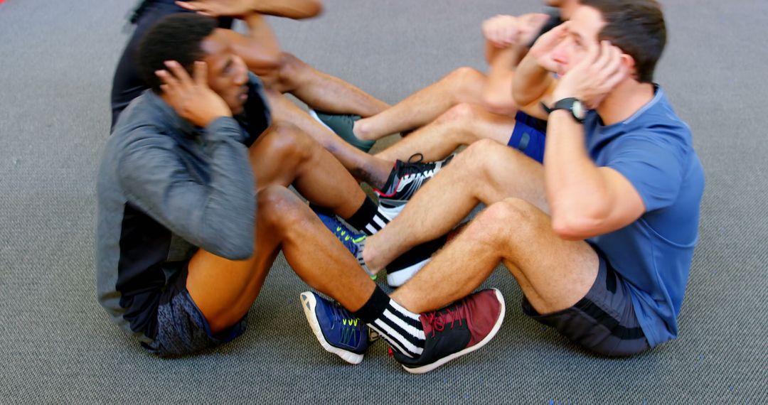 Diverse Group Engaging in Fitness Training Doing Sit-ups Together - Free Images, Stock Photos and Pictures on Pikwizard.com