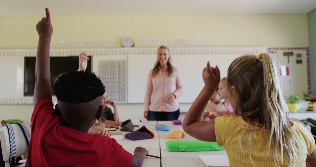 Teacher Leading Classroom Discussion with Engaged Students Raising Hands - Free Images, Stock Photos and Pictures on Pikwizard.com