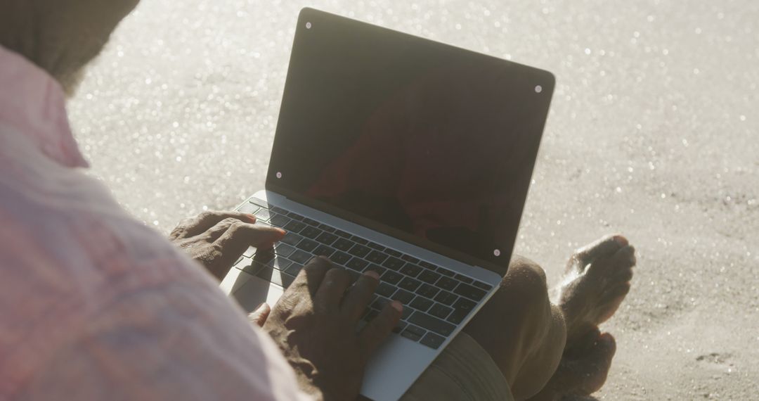 Person Working on Laptop on Beach, Remote Work Concept - Free Images, Stock Photos and Pictures on Pikwizard.com