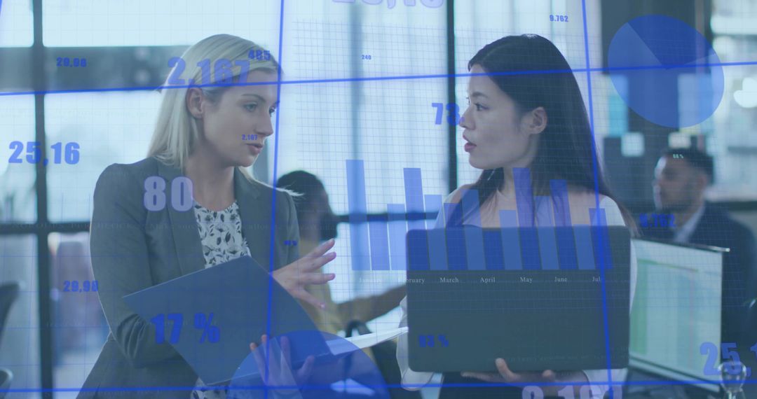 Business Professionals Collaborating Over Data Analysis in Modern Office