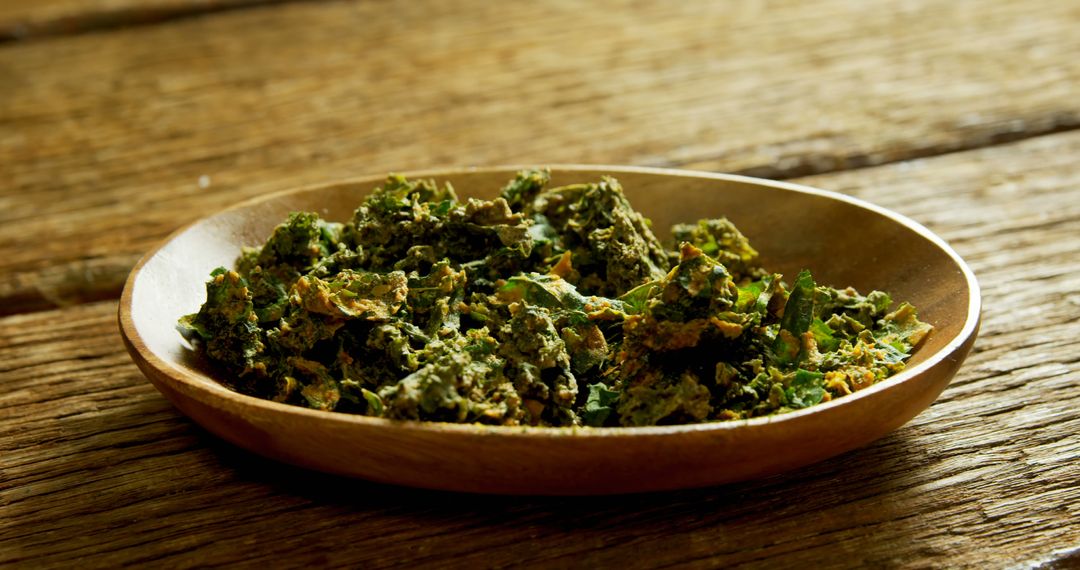 Close-Up of Crispy Kale Chips on Wooden Platter - Free Images, Stock Photos and Pictures on Pikwizard.com