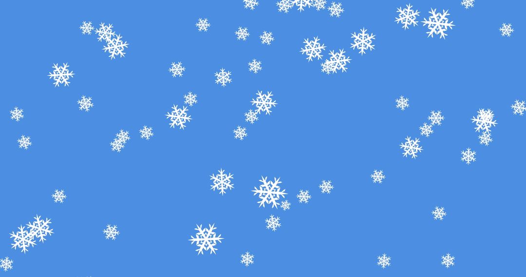 Winter Snowflakes Falling Against Blue Sky