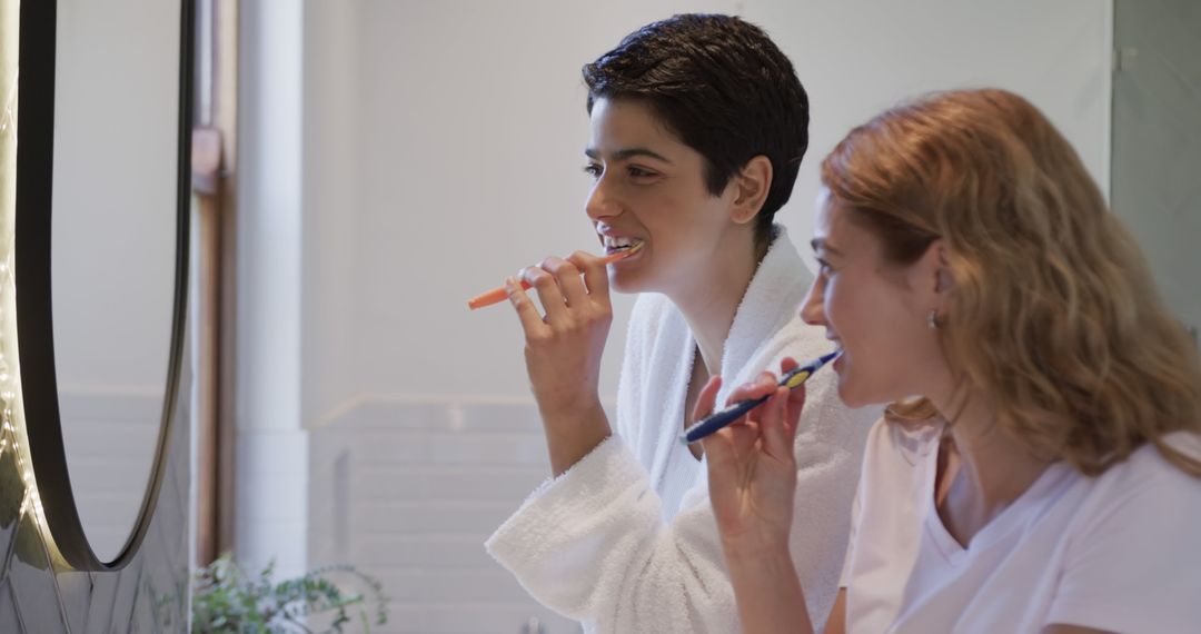 Couple Brushing Teeth in Modern Bathroom Mirror Together - Free Images, Stock Photos and Pictures on Pikwizard.com