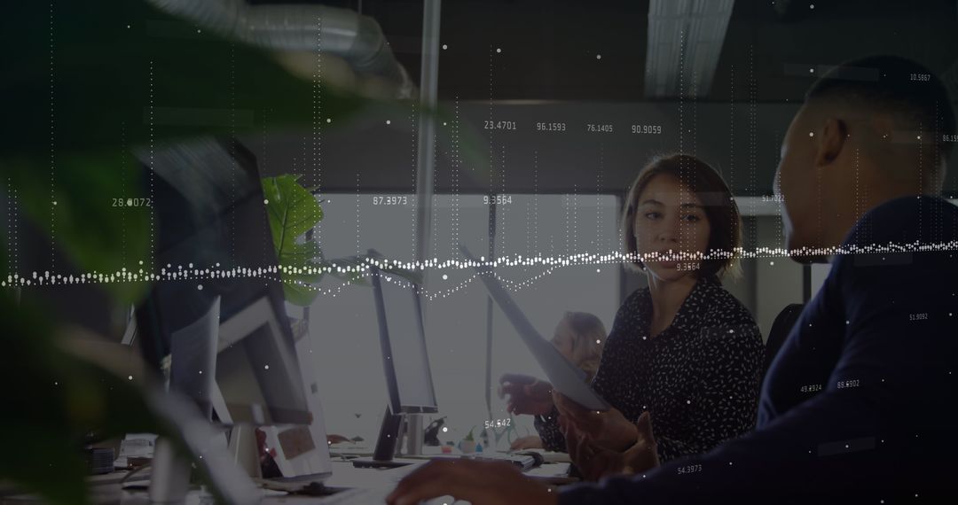 Business Colleagues Analyzing Data Insights in Modern Office Environment