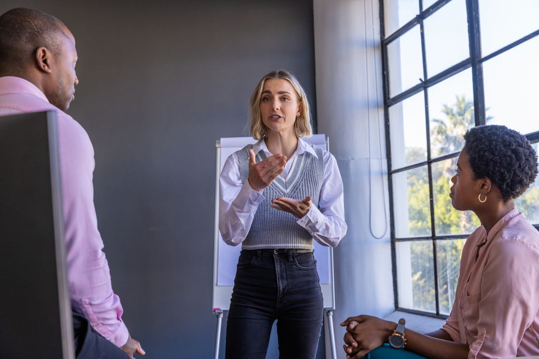 Diverse Coworkers Collaborating During Office Presentation