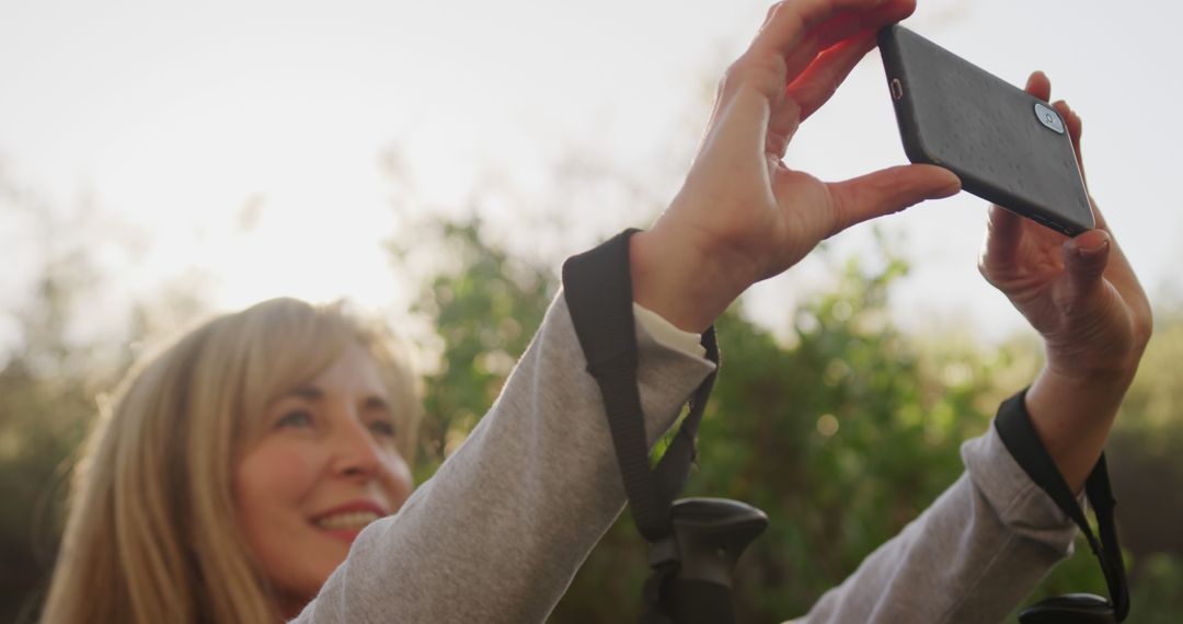 Woman Taking a Selfie Outdoors with Smartphone - Free Images, Stock Photos and Pictures on Pikwizard.com