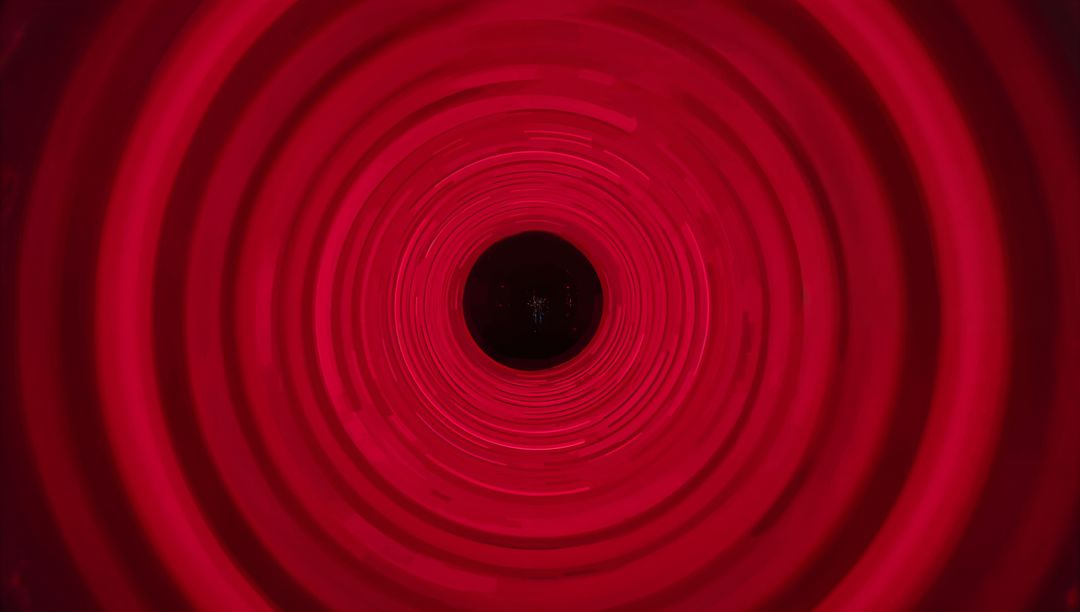 Immersive Red Concentric Tunnel Emitting LED Glow with Dark Central Aperture