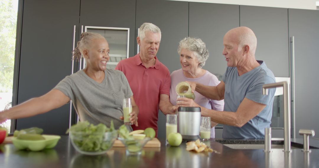 Happy Senior Friends Making Smoothies in Modern Kitchen - Free Images, Stock Photos and Pictures on Pikwizard.com