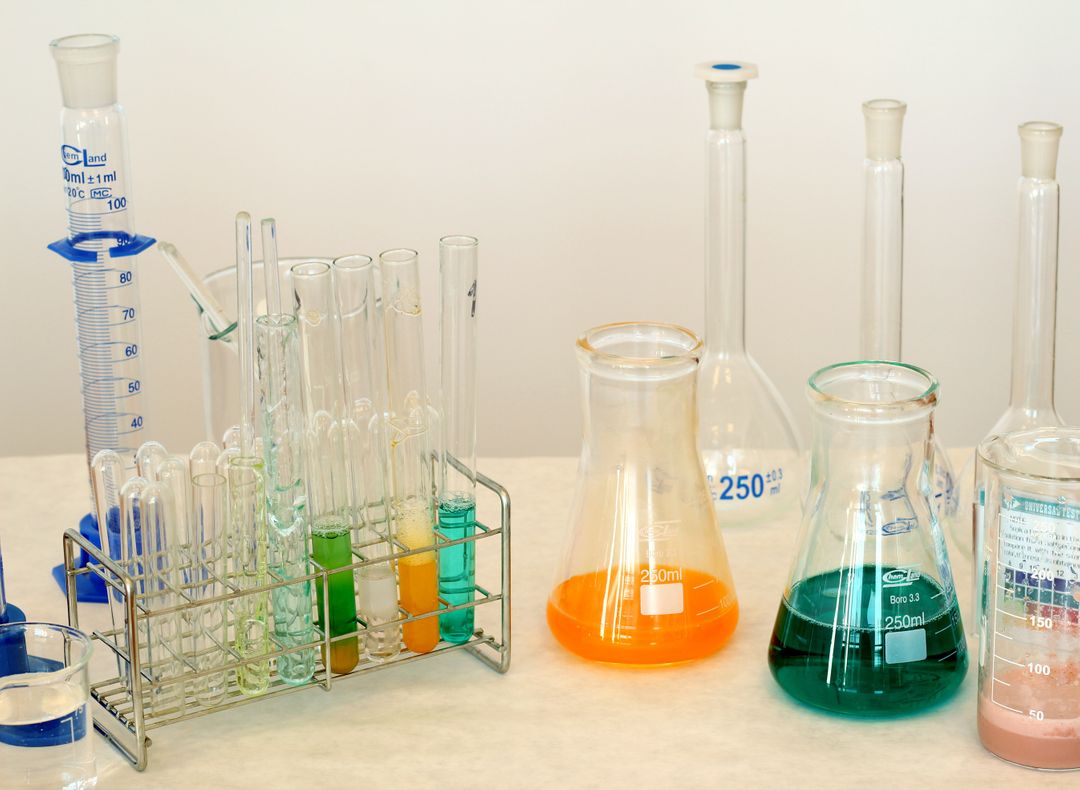 Laboratory glassware with colorful chemical solutions - Free Images, Stock Photos and Pictures on Pikwizard.com