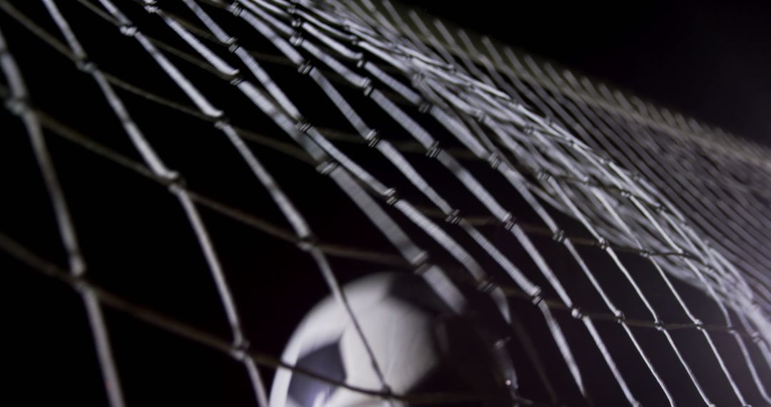 Soccer Ball Hitting Net at Night Close Up - Free Images, Stock Photos and Pictures on Pikwizard.com