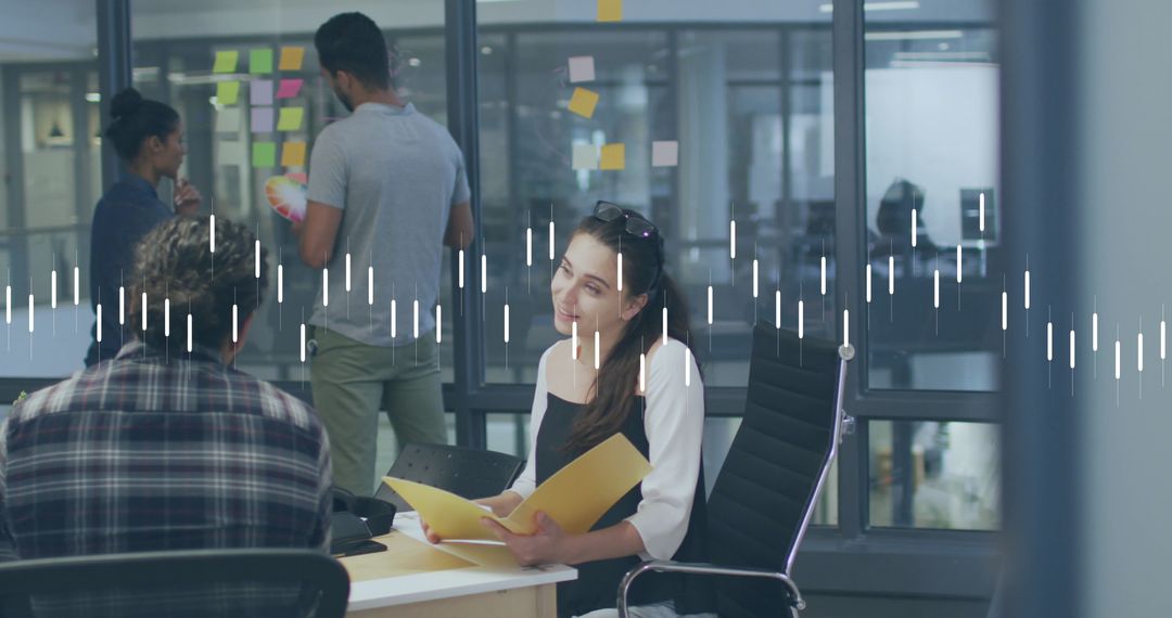 Diverse Coworkers Analyzing Data in Modern Office