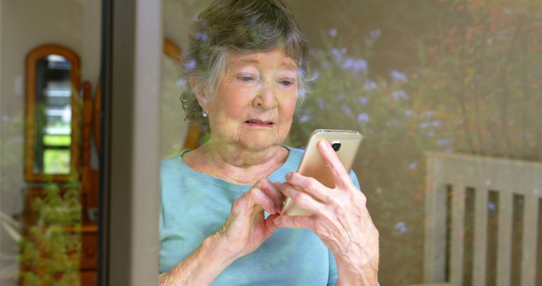 Senior Woman Using Smartphone Through Window - Free Images, Stock Photos and Pictures on Pikwizard.com