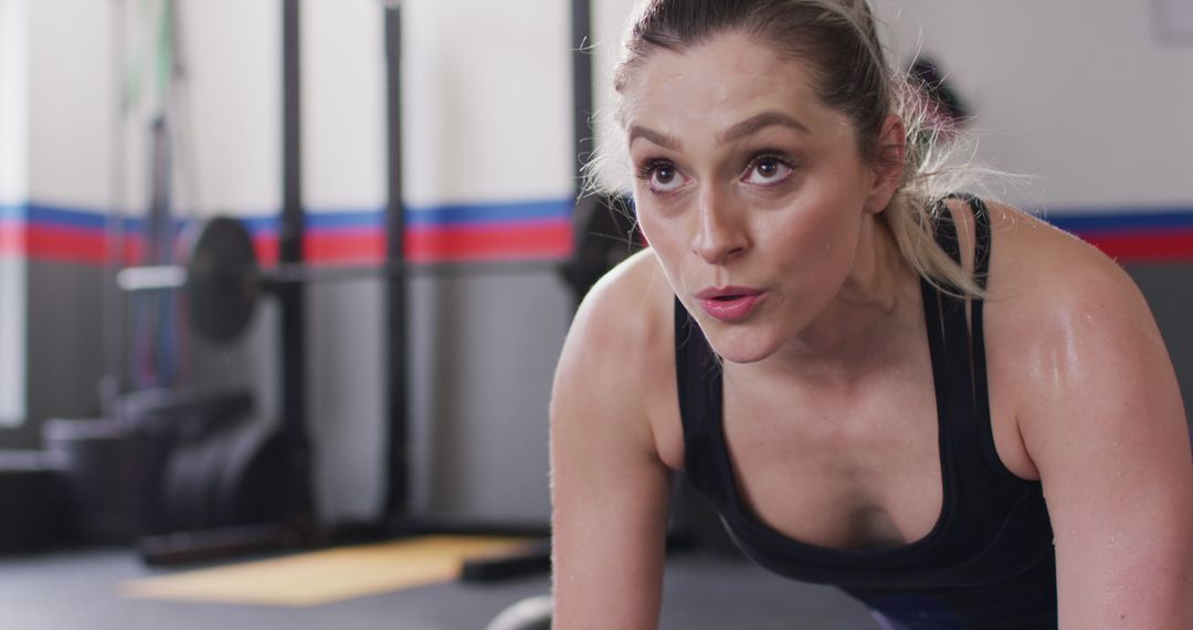 Close up image of determined caucasian woman doing push ups working out at a gym - Free Images, Stock Photos and Pictures on Pikwizard.com