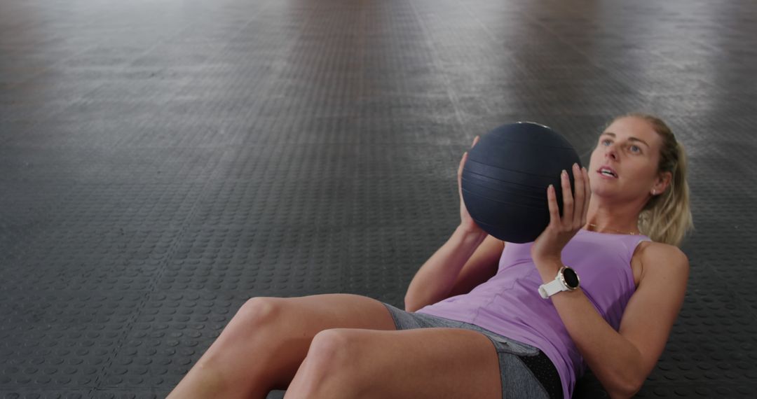 Woman Performing Medicine Ball Exercises in Fitness Gym - Free Images, Stock Photos and Pictures on Pikwizard.com