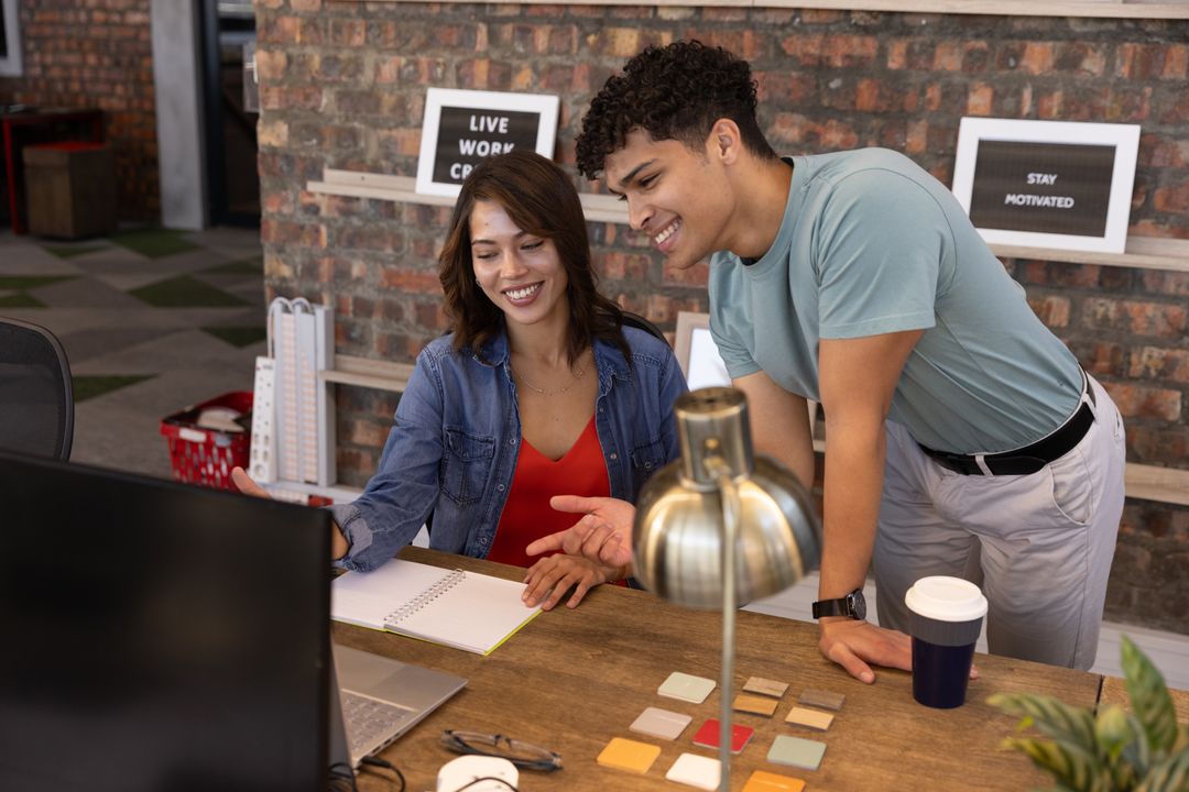 Diverse Coworkers Collaborate Creatively in Modern Workspace