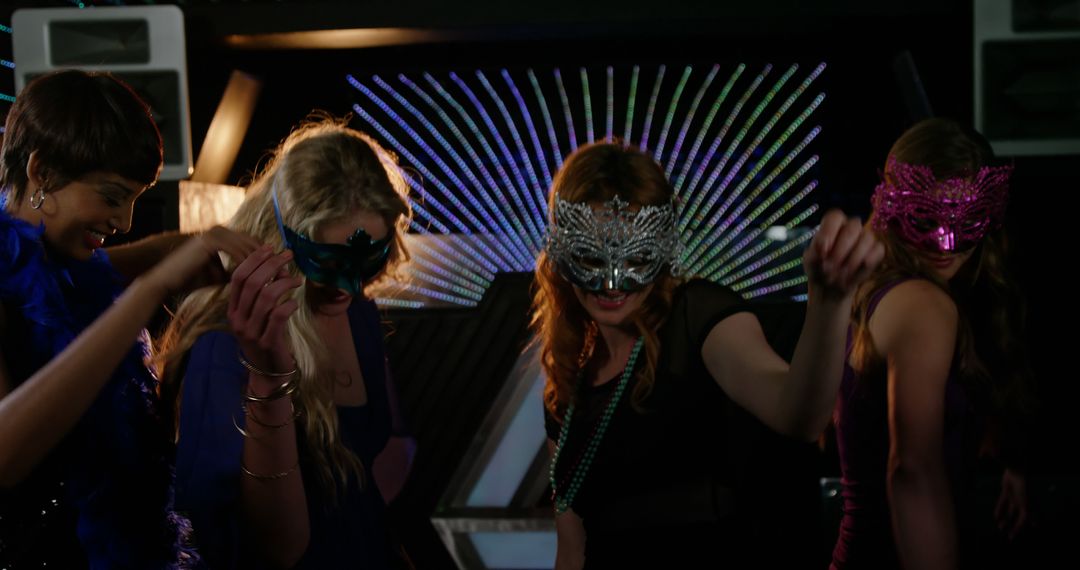 Group of Women Dancing with Masquerade Masks at Nightclub - Free Images, Stock Photos and Pictures on Pikwizard.com