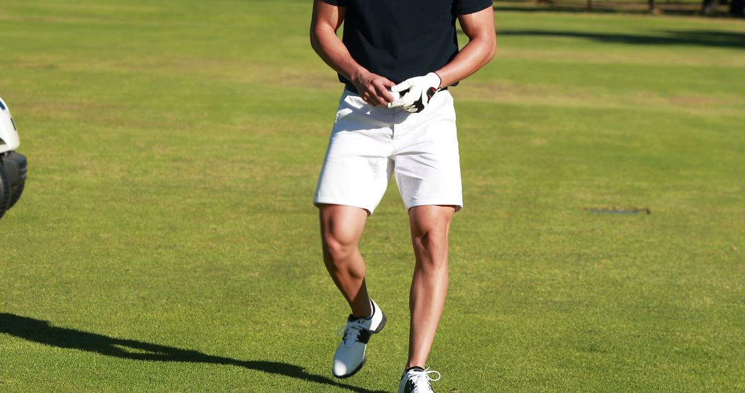 Young Athlete Walking on Golf Course in Summer - Free Images, Stock Photos and Pictures on Pikwizard.com