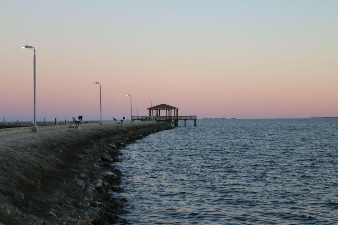 Sunset at Serene Waterfront With Pier and Gazebo - Free Images, Stock Photos and Pictures on Pikwizard.com