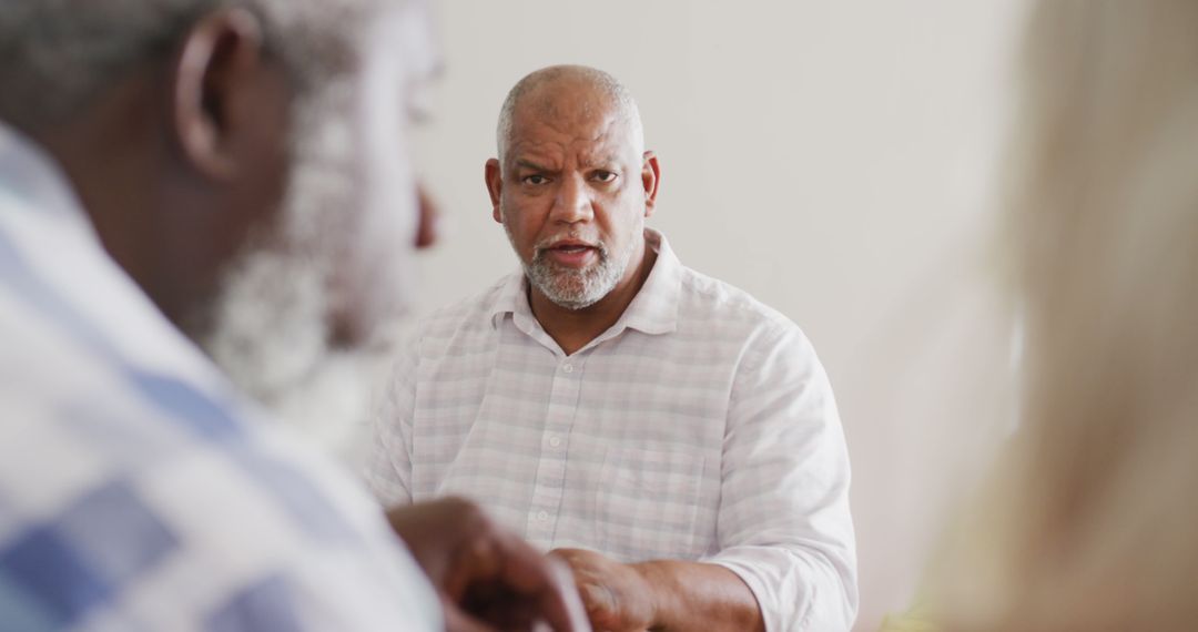 Senior Group Enjoying Dinner and Conversation