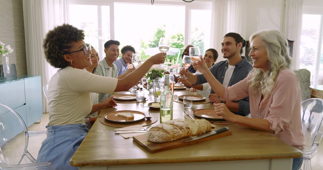 Diverse Group Sharing Meal and Toasting Together