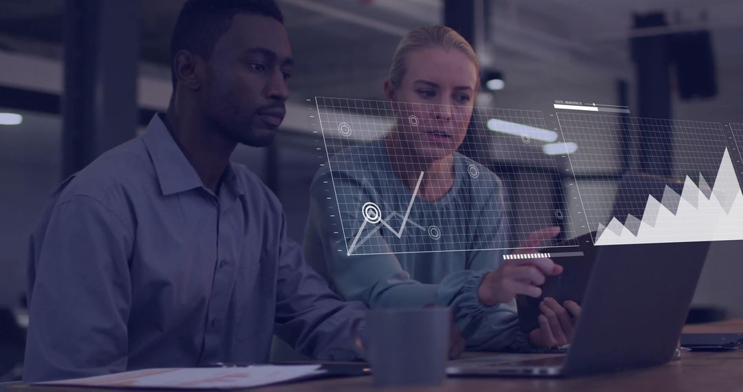 Diverse Team Collaborating Over Financial Data Analysis in Modern Office