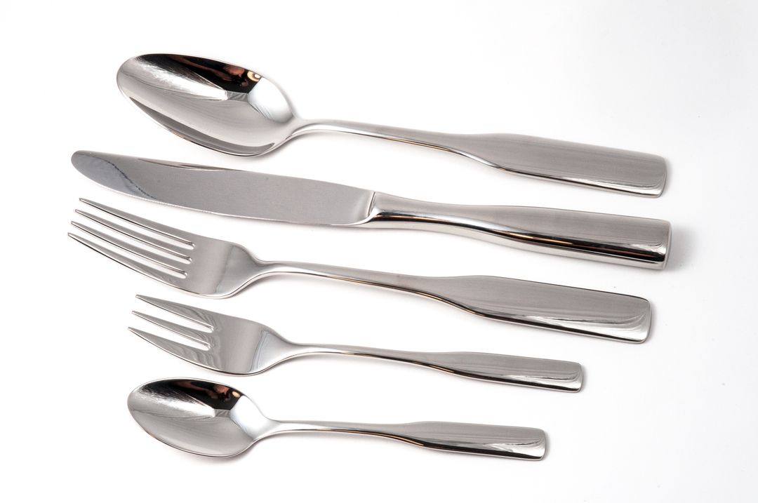 Elegant Stainless Steel Cutlery Set on White Background - Free Images, Stock Photos and Pictures on Pikwizard.com